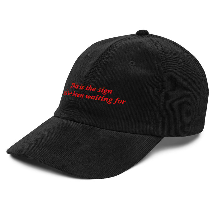 The Sign, black corduroy cap embroidered in red